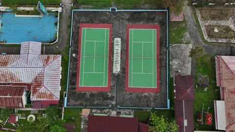 Aerial Top-Down View of Outdoor Tennis Courts in a Residential Area Stock Footage 329838618