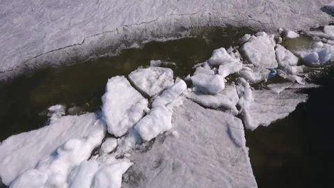 Aerial top down view over icy river surface pattern. Winter season on Volga Stock Footage 91165378