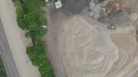 Aerial top down view over sand. motorway roadbed is being repaired Stock Footage 145915399
