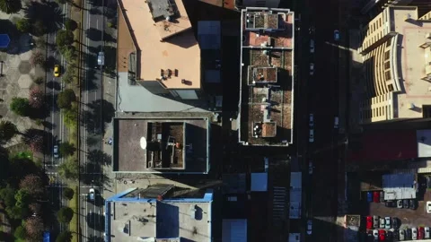 Aerial top down view over a cityscape with high or tall buildings Stock Footage 146341662