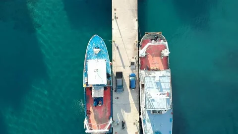 Aerial top down view over fishong boats in Patitiri, in Alonissos island, Spo 動画素材 166028870