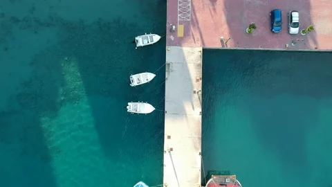 Aerial top down view over fishong boats in Patitiri, in Alonissos island, Spo 動画素材 166029309