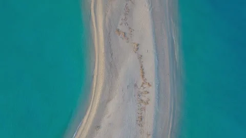 Aerial top-down view over sandy Possidi Cape at dawn Stock Footage 263929818