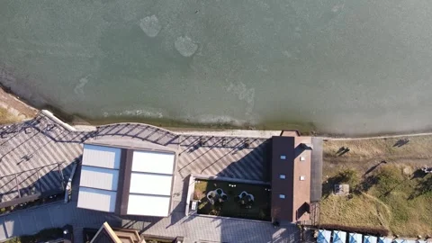Aerial top-down view of the Panorama restaurant and lakeshore, Nalchik Video stock 338005064