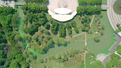 Aerial top down view of a park with green fields, alleys, canels, trees and Stock Footage 152896020