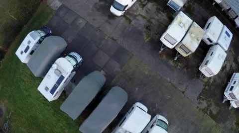 Aerial top down view parked travel trailers camper trailers caravans 4k Stock Footage 60578546
