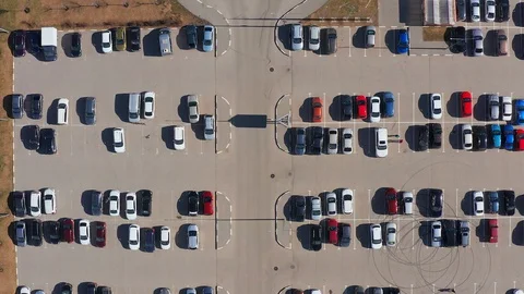 Aerial top-down view of parking lot near city mall. Stock Footage 107222622
