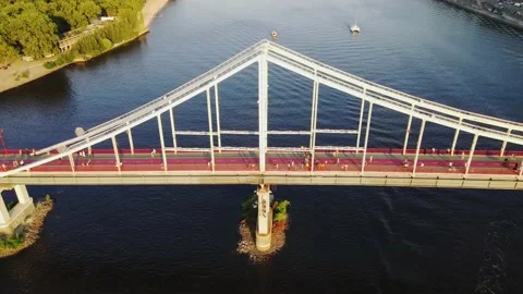 Aerial top down view of the pedestrian bridge over the Dnipro river in Kyiv Stock Footage 200507272