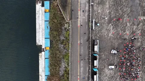 Aerial Top Down View of People Running Near Waterfront 4K Drone Stock Footage 320058780