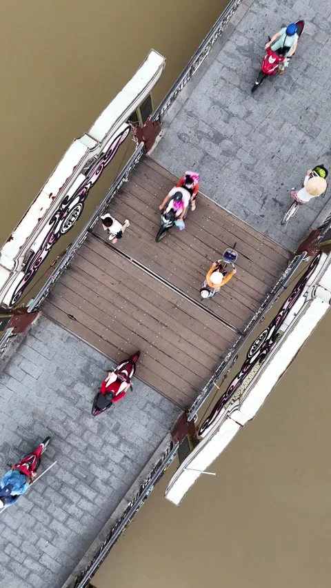 Aerial Top Down View of People Crossing a Bridge in Hoi An, Vietnam Stock Footage 335832117