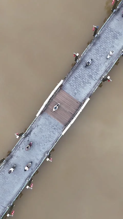 Aerial Top Down View of People Crossing a Bridge in Hoi An, Vietnam Stock Footage 335832213