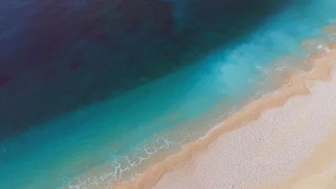 Aerial top down view of perfect turquoise beach. Сlear blue sea water - perfect Video stock 125508873