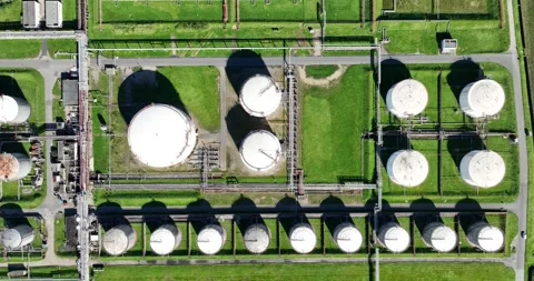 Aerial top down view on petroleum silos at refinery. Metal tanks. Stock Footage 254010261