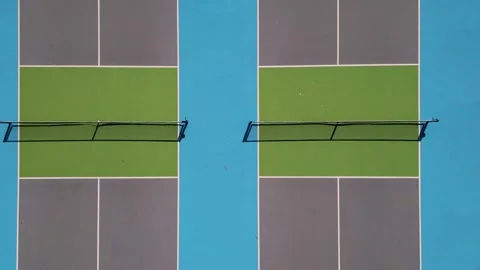 Aerial top down view of pickleball or tennis courts with nets and surface lines Stock Footage 346231330