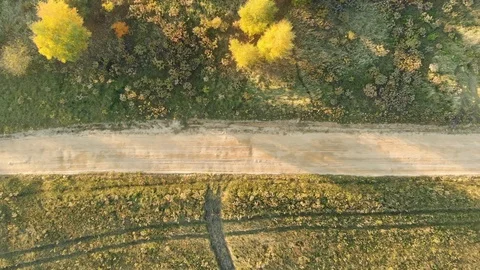 Aerial top-down view of the plowed field during sunset Stock-Footage 108382348