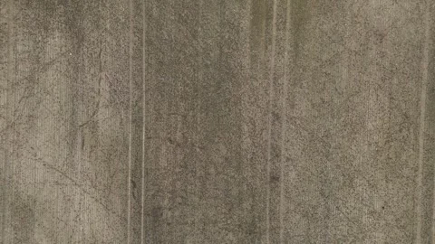 Aerial Top Down View of Plowed Field Soil Texture with Tractor Tracks Stock Footage 323331003