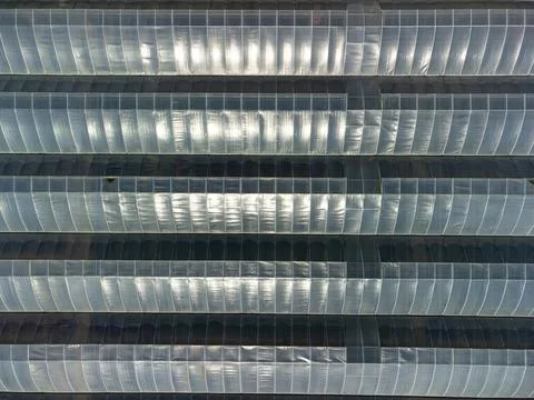 Aerial top down view of poly tunnel green houses used in British agriculture Stock Photos