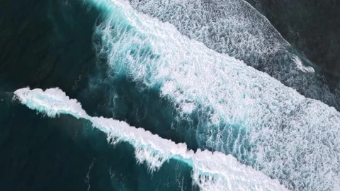 Aerial Top Down View of Powerful Indian Ocean Waves Breaking Over Coral Reef Stock Footage 339509392