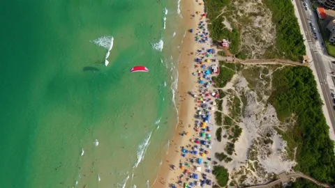 Aerial top down view Praia dos Ingleses beach powered paraglider flying over Vidéo 328705837