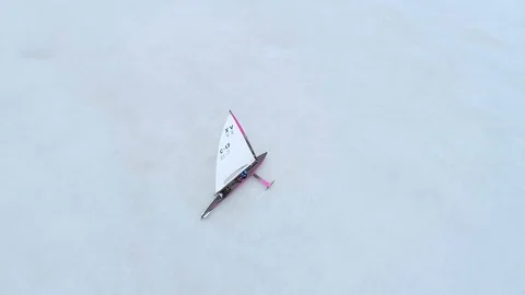 Aerial top-down view of a racing two-person ice sailing boat (Monotype-XV class) Stock Footage 88201591