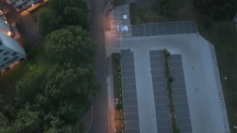 Aerial top down view of residential parking and rooftops at dusk Bremen 動画素材 336858296