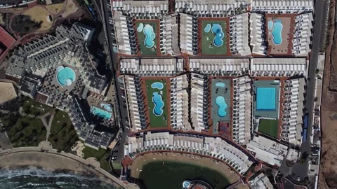 Aerial top down view of resort hotel swimming pools 4k Stock Footage 278651257