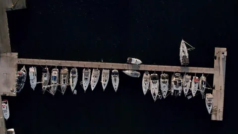 Aerial top down view of rich yacht sailing sea. Summer journey on luxury ship. Stock Footage 284715749