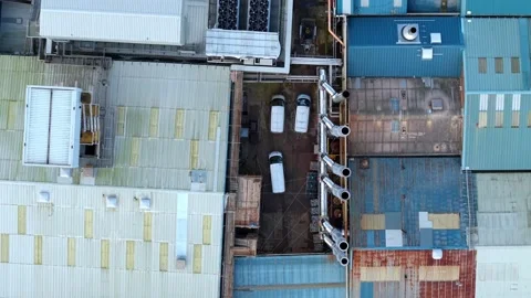 Aerial top down view rising above old factory warehouse facility and indust.. Stock Footage 337747864