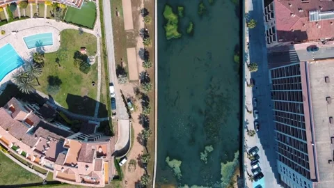 Aerial top down view of river filled with algae bloom and bridge Costa Brav.. 스톡 동영상 245993071