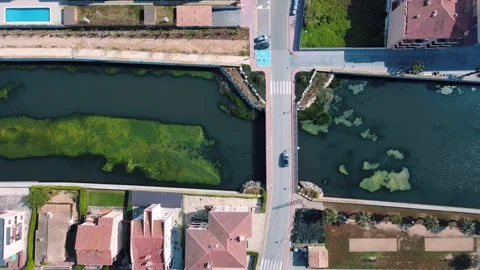 Aerial top down view of river filled with algae bloom in Palamos Catalonia 스톡 동영상 245997264