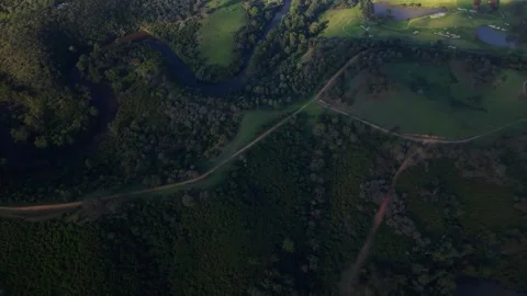 Aerial top down view of river winding through green landscape of Mount Lofty Stockbeeldmateriaal 334841367