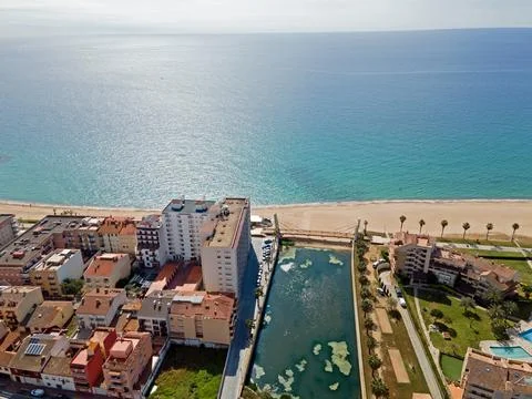 Aerial top down view of river filled with algae bloom in Palamos Catalonia Stock Photos