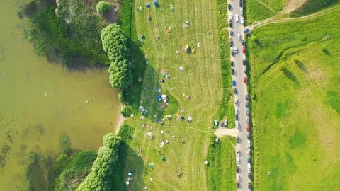 Aerial top down view of the road along the lake and green coast Stock Footage 109462690