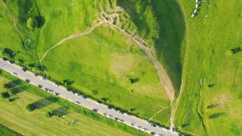 Aerial top down view of the road along the lake and green coast Stock Footage 109462704
