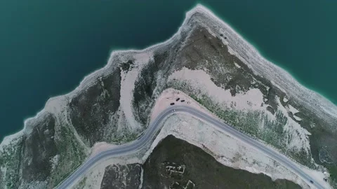 Aerial top down view of a road along the Lake Kazenoy Am's shore in Chechen Видео 201251634
