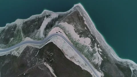 Aerial top down view of a road along the Lake Kazenoy Am's shore in Chechen Stock-Footage 201251763