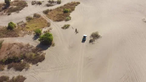 Aerial Top Down View of Off Road Vehicle Crossing Gumuk Pasir Parangkusumo .. Video stock 341548163