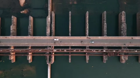 Aerial Top Down View Of Road And Railway Bridge Over River With Cars Video stock 344449752