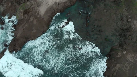 Aerial top down view of rock beach in Java Island, Indonesia Stock Footage 147733448