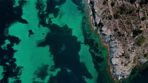 Aerial top down view of rock structures in the Mediterranean Sea in Port Ll.. Stock-Footage 245931498