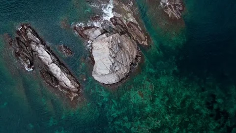 Aerial top down view of rocks in the Mediterranean Sea along Costa Brava Ca.. Stock-Footage 245916991