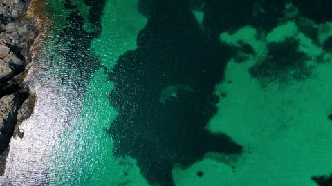 Aerial top down view of rocks in the Mediterranean Sea in Port Lligat Costa.. Stock-Footage 245931566