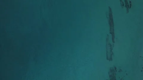 Aerial top down view of rocks in the Mediterranean Sea near Palamos beach C.. 스톡 동영상 246303678