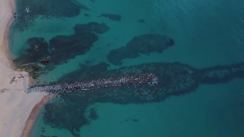Aerial top down view of rocks in the Mediterranean Sea near Palamos beach C.. 스톡 동영상 246303741