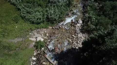 Aerial Top-Down View of Rocky Mountain Creek and Alpine Stream Crossing Stock Footage 100470186