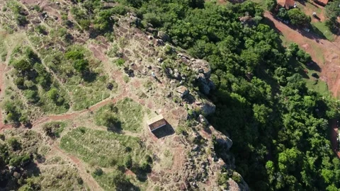 Aerial Top Down View of Rocky Hill and Native Forest in Paraguari Paraguay Video stock 335906582