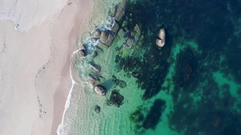 Aerial top down view of a rocky coast with turquoise water The Concept of w.. Stock Footage 336096828