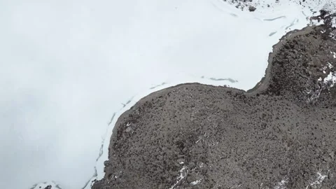 Aerial Top-Down View of Rocky Mountain Terrain and Snowfield in Sichuan China Stock Footage 338309049