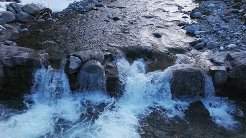 Aerial top-down view of rocky mountain stream in Alpe Ventina, Italy. Slow Stock Footage 341457107