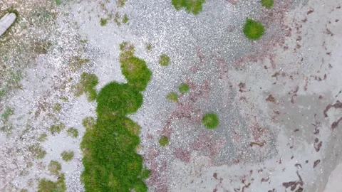 Aerial Top Down View with Rotating Pull Out Movement Over Grey Bay Beach, Stock Footage 252731924